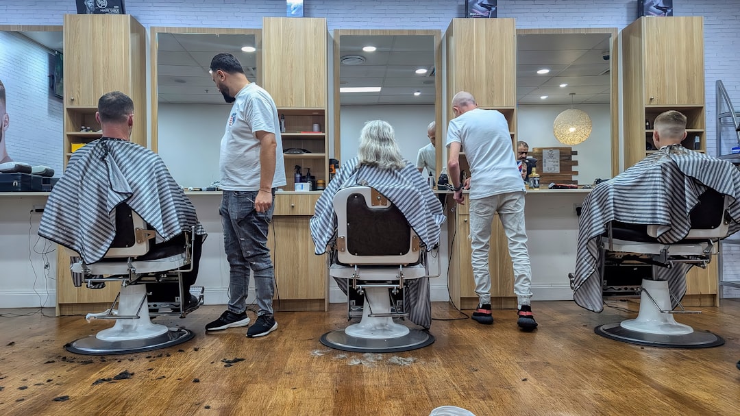 Barbers cutting hair in a modern salon