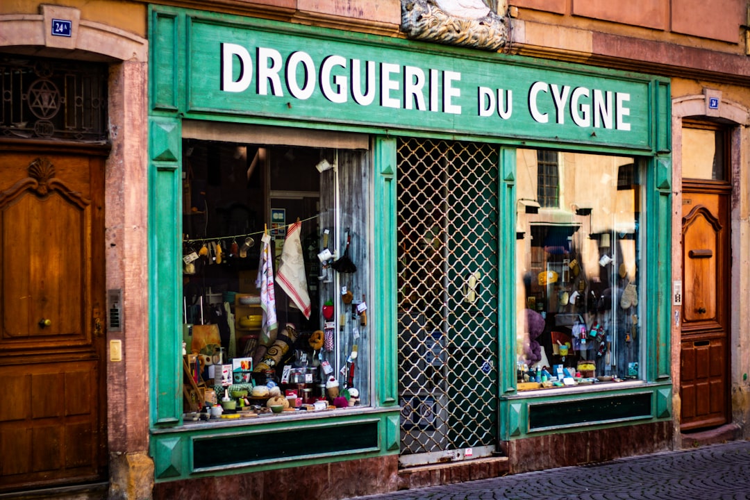 Old storefront with green facade and signage