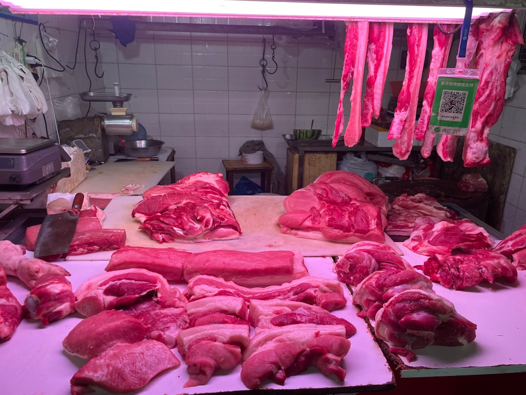 Various cuts of raw meat displayed at a butcher shop