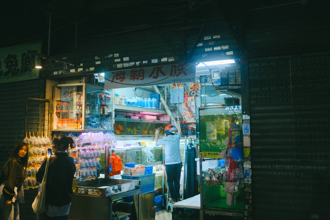 A brightly lit shop at night with many items