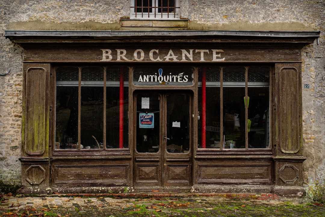 An old building with a sign that says brocante